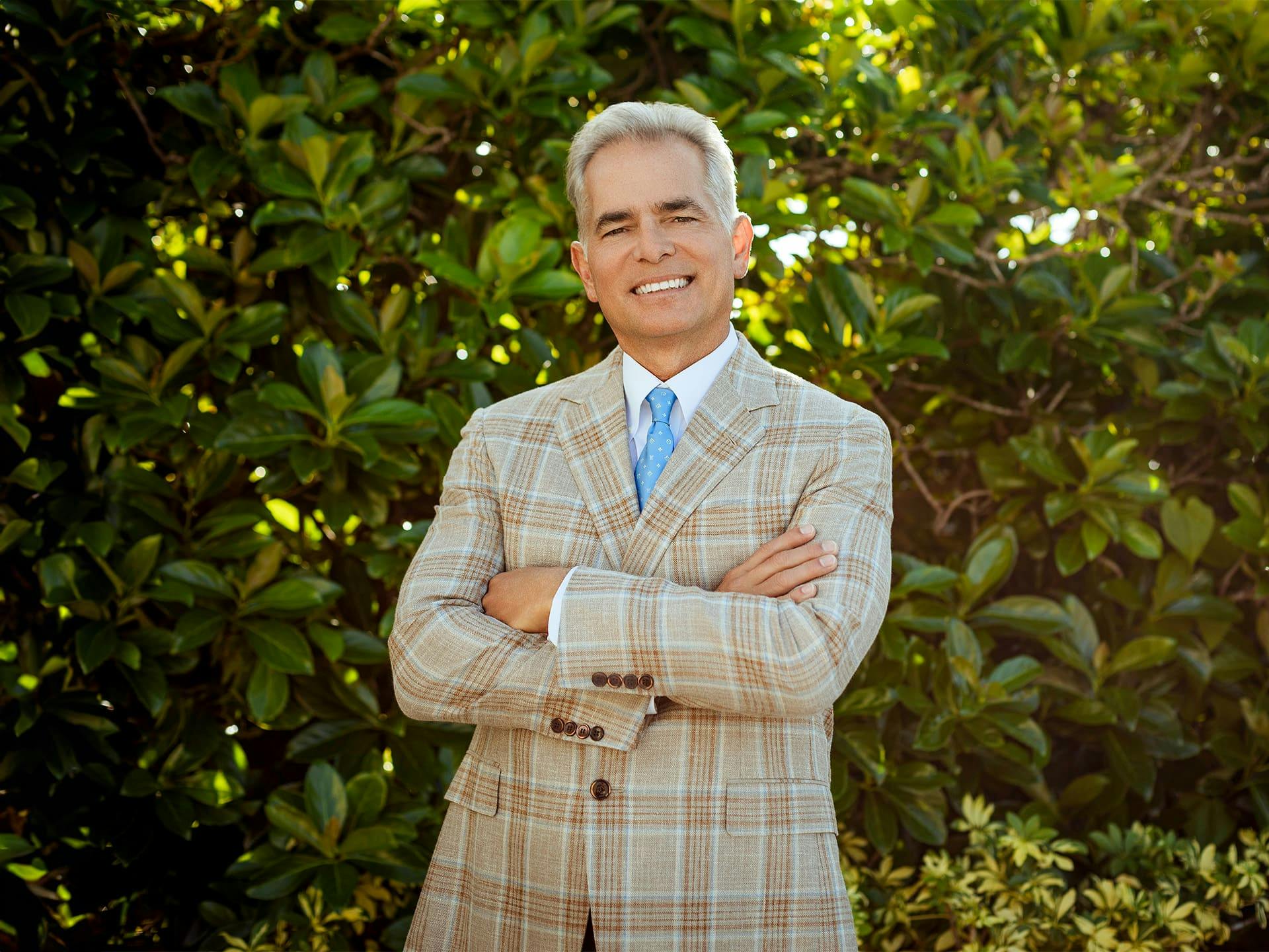 Edward Scherder crossing his arms and smiling