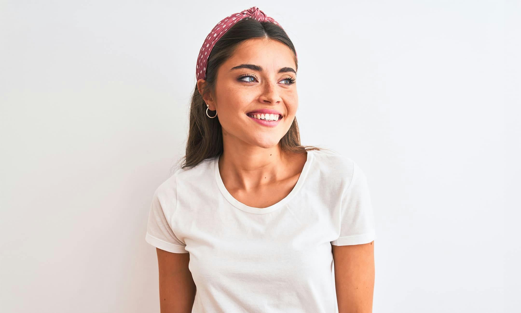 woman smiling and looking to her left