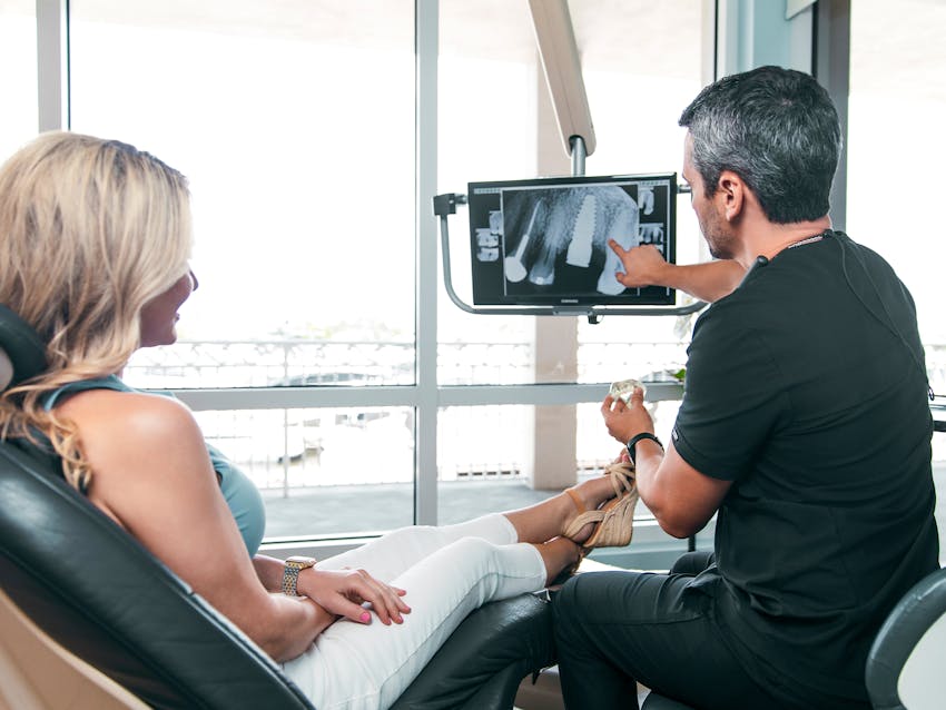 dentist looking at patient's xrays