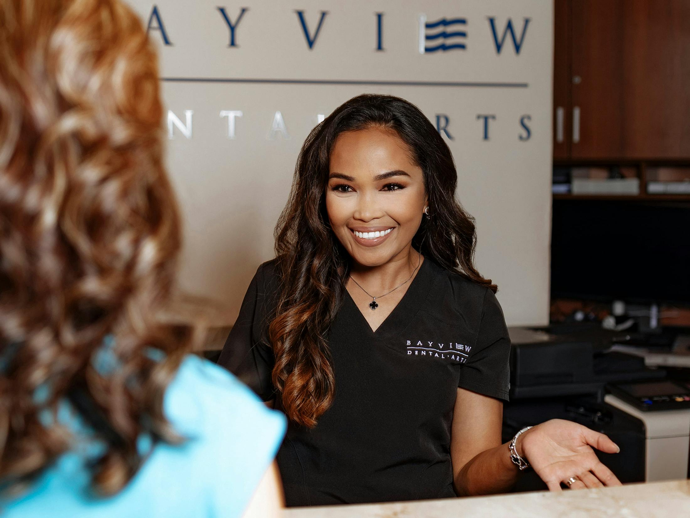 receptionist greeting patient
