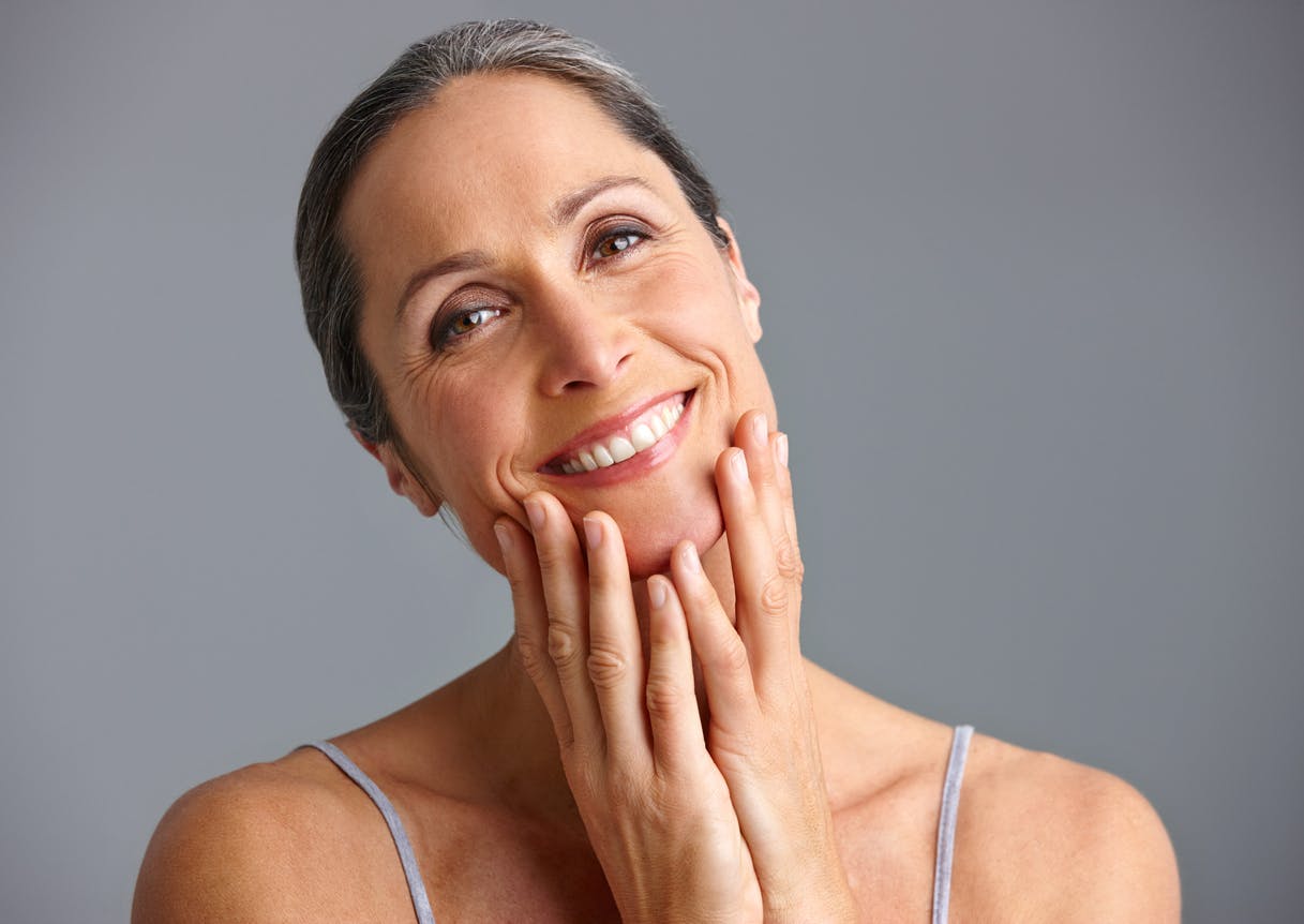 Woman touching her lower face
