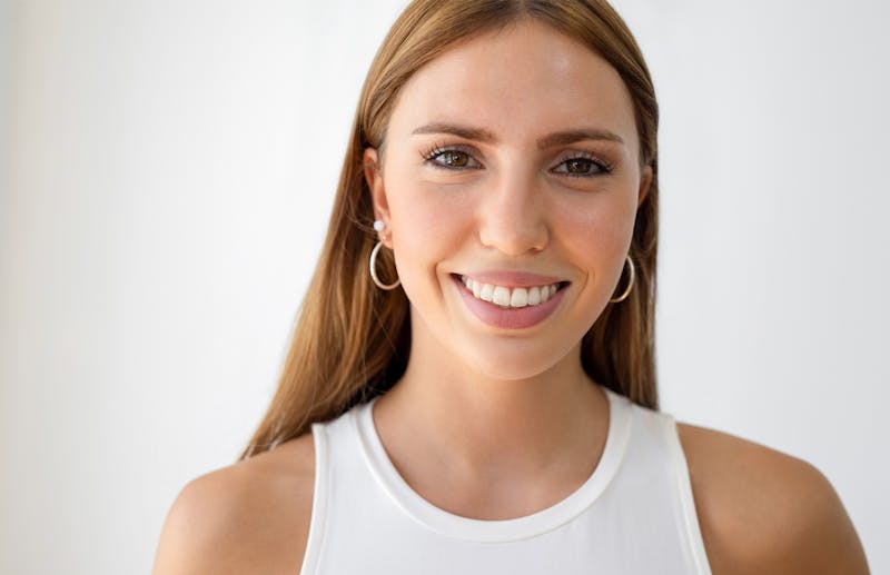Woman wearing a tank top smiling