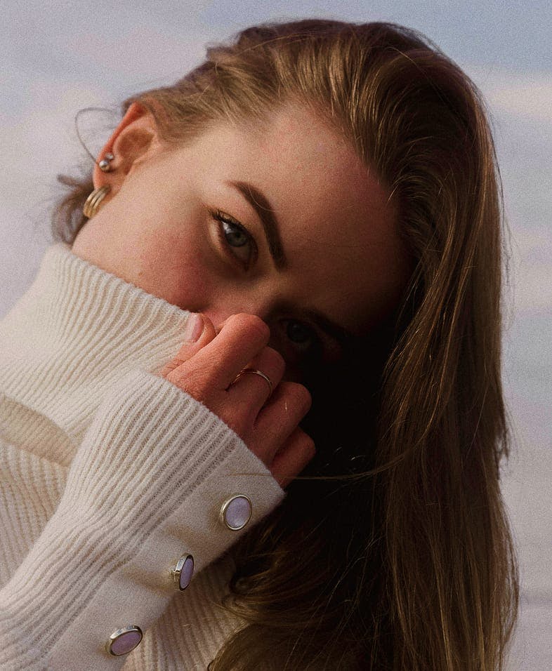 Woman covering her face