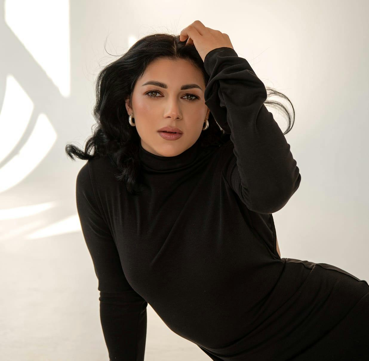 woman in a black long sleeve shirt