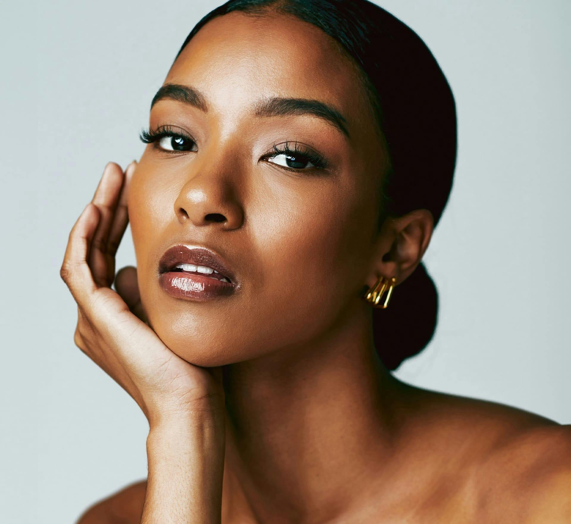 woman resting chin on hand