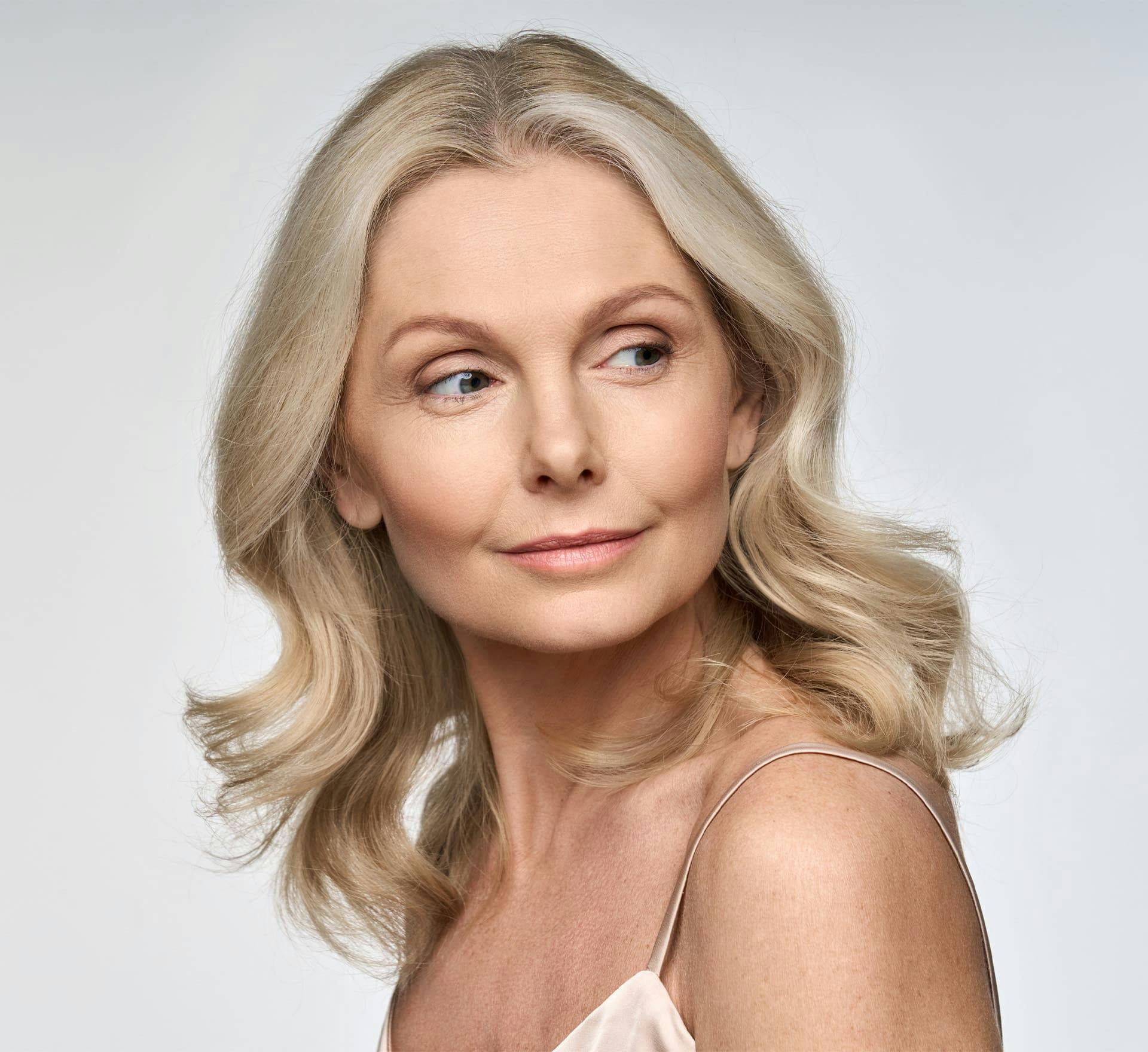 Woman smiling looking over shoulder