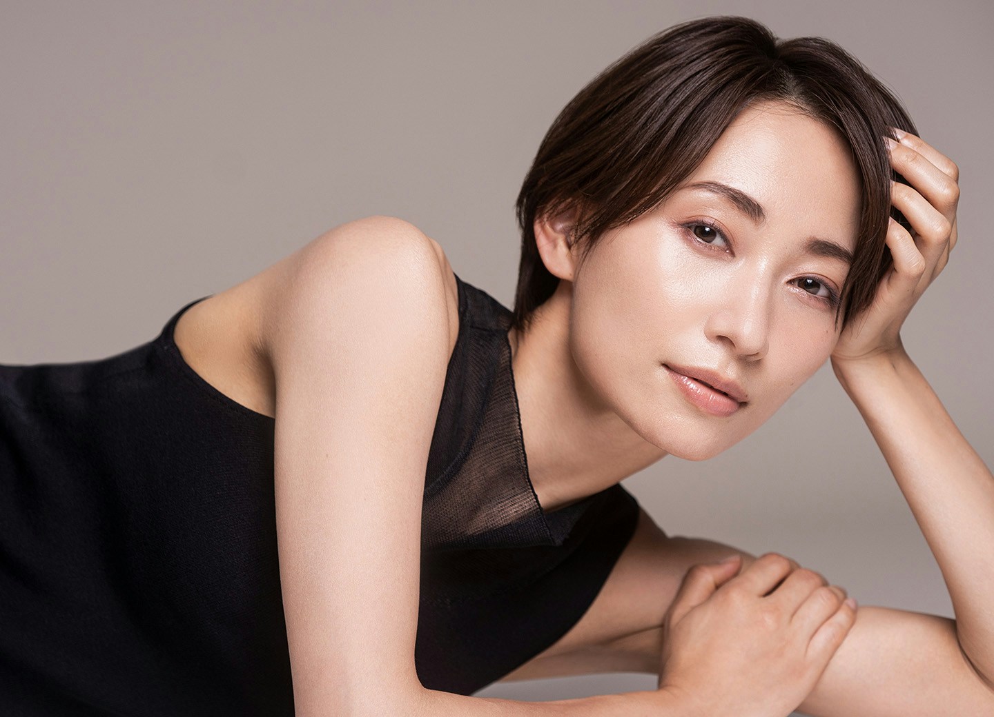 Woman resting head on hand