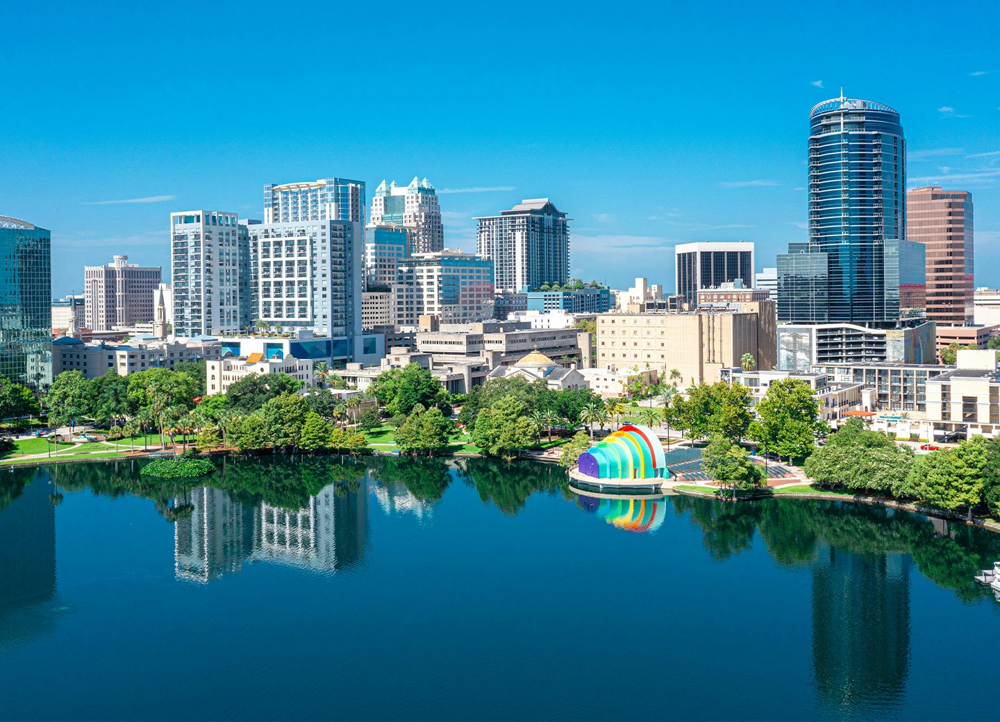 A city skyline next to a lake
