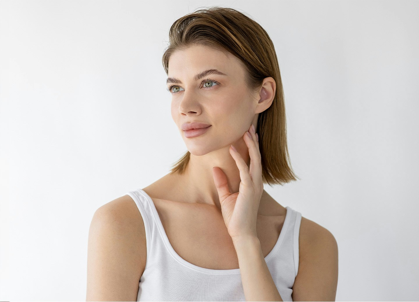 Woman with hand on chin