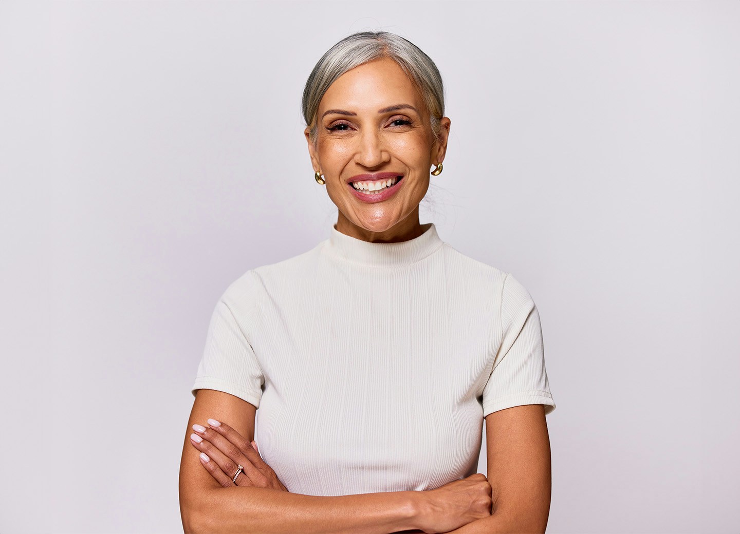 Woman smiling woth arms crossed