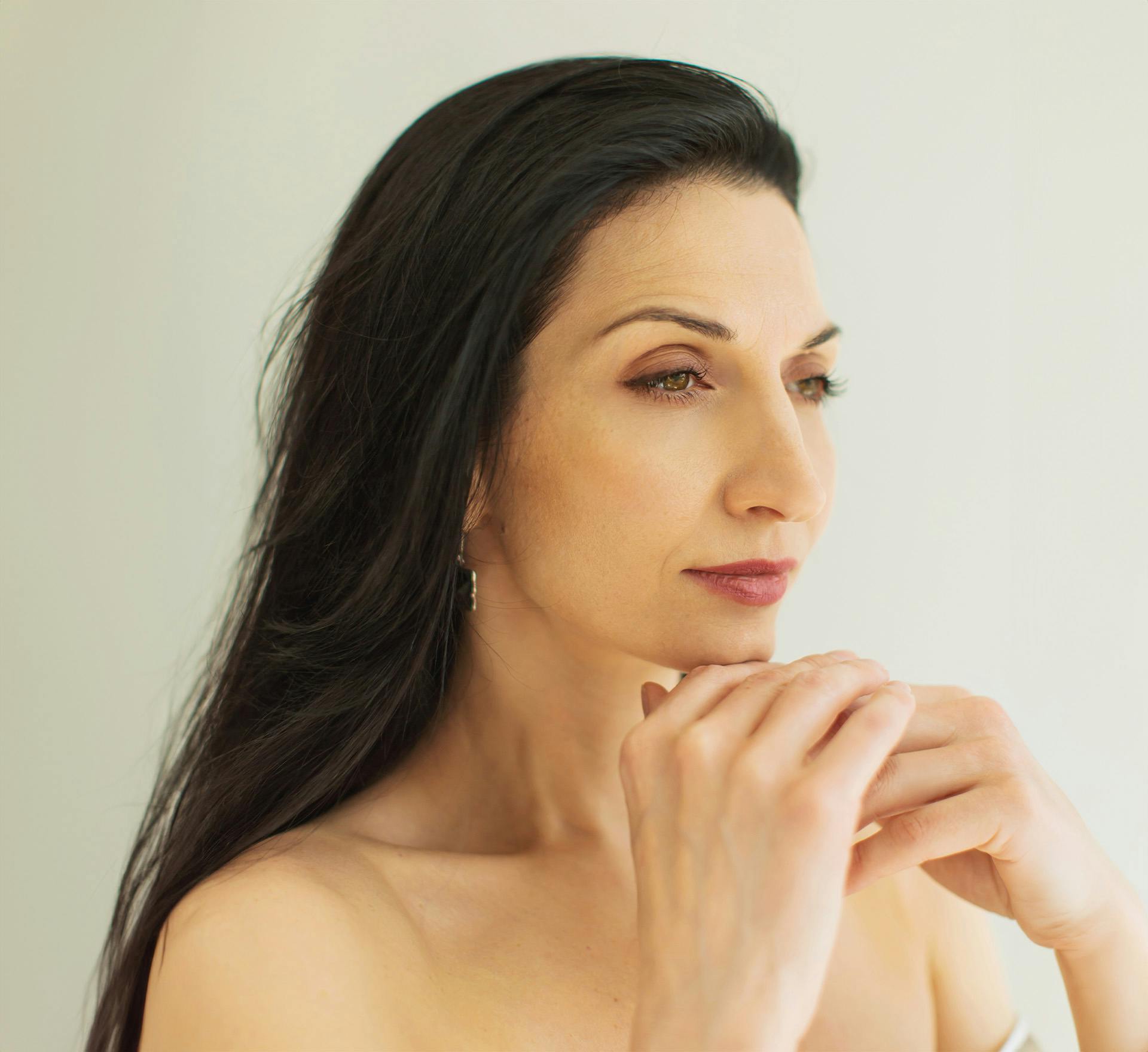 Woman resting chin on hands