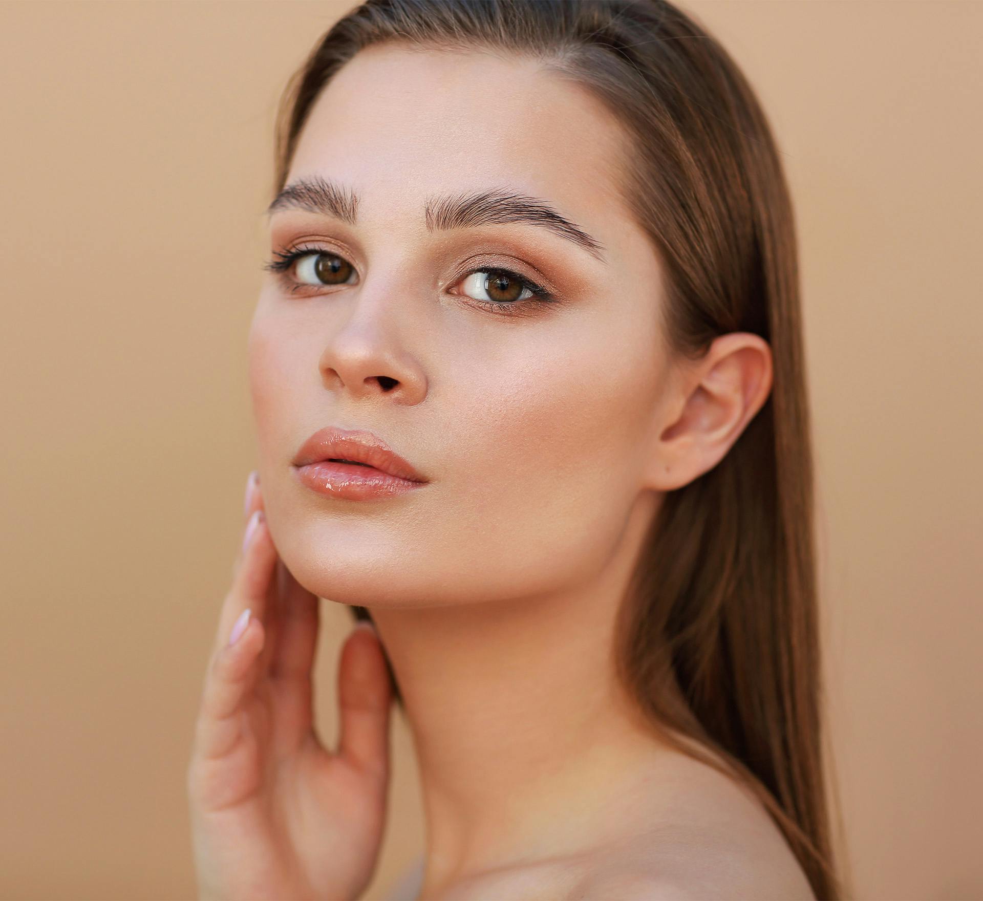 Woman with hand on cheek