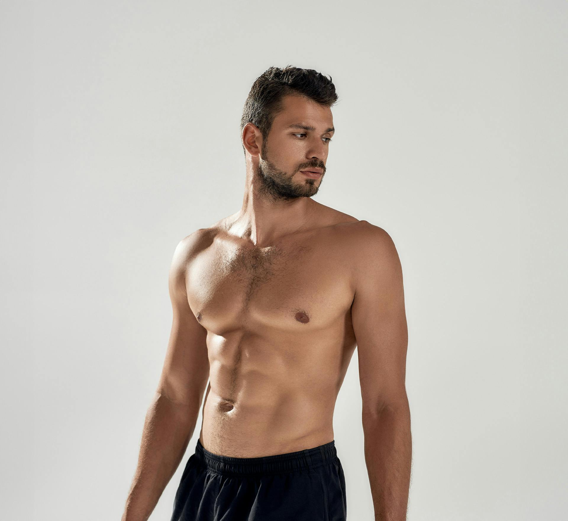 Shirtless man standing