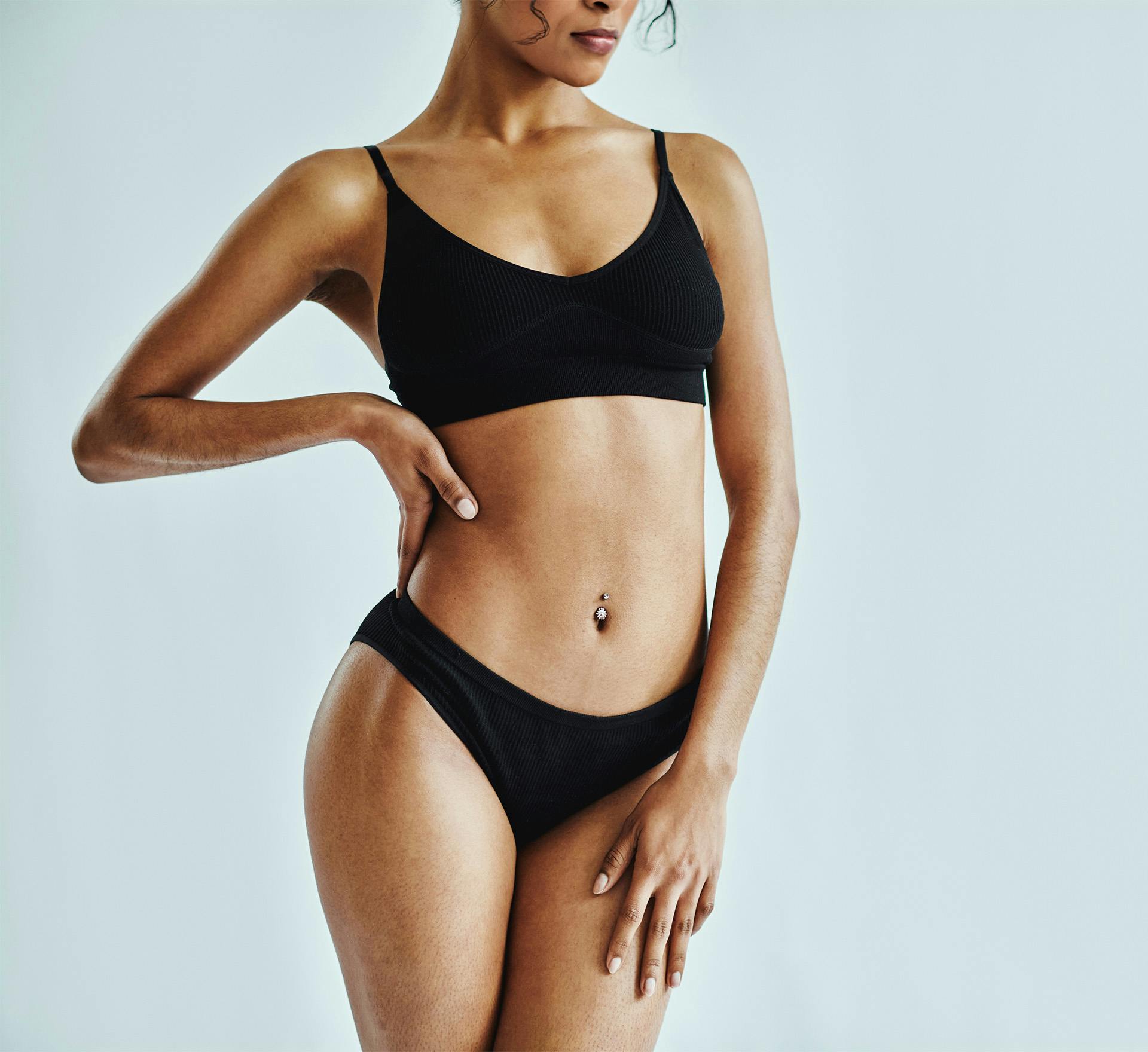 Woman standing with hand on hip