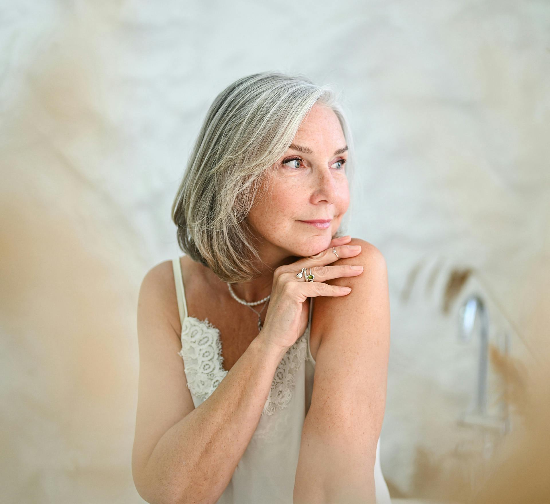 Woman with hand on shoulder