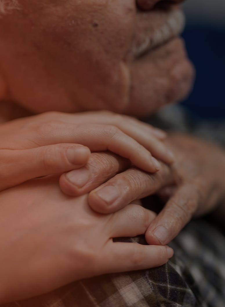 someone touching the sholdure of an elderly man