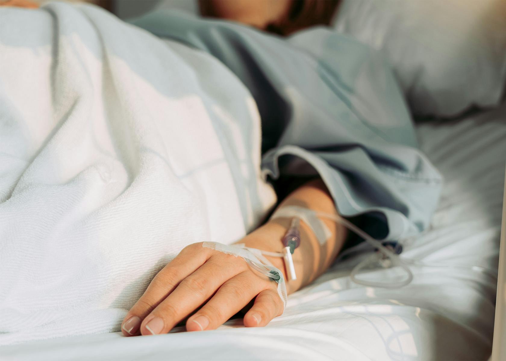 patient with IV in their arm