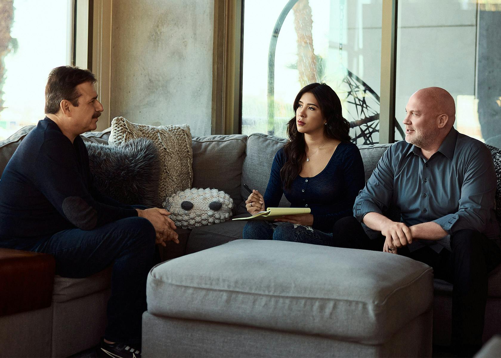 client and lawyer speaking on couch