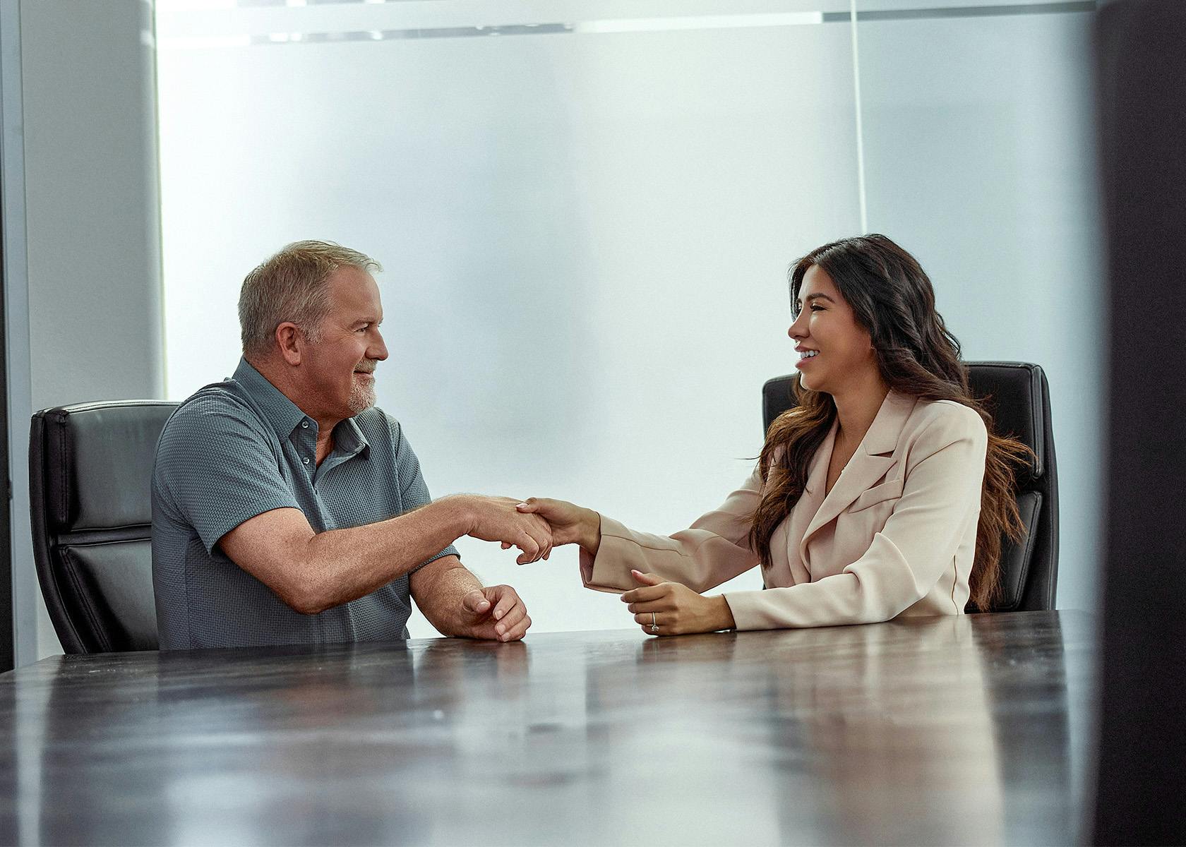 client and lawyer shaking hands
