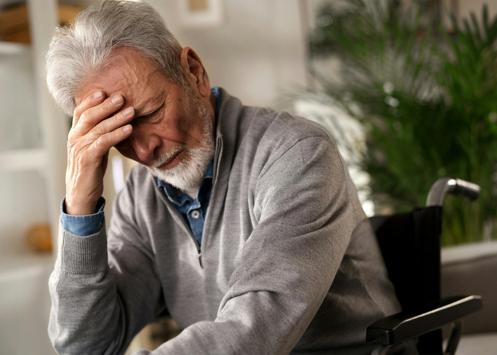 man with head in hands