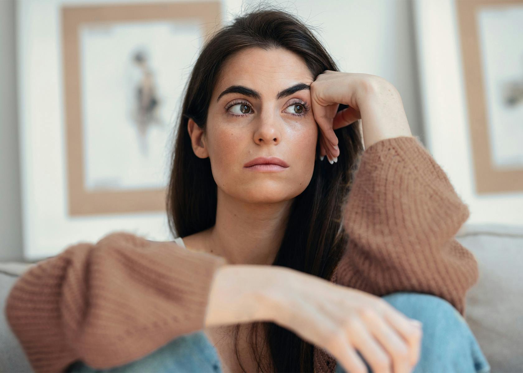 woman with head in hands