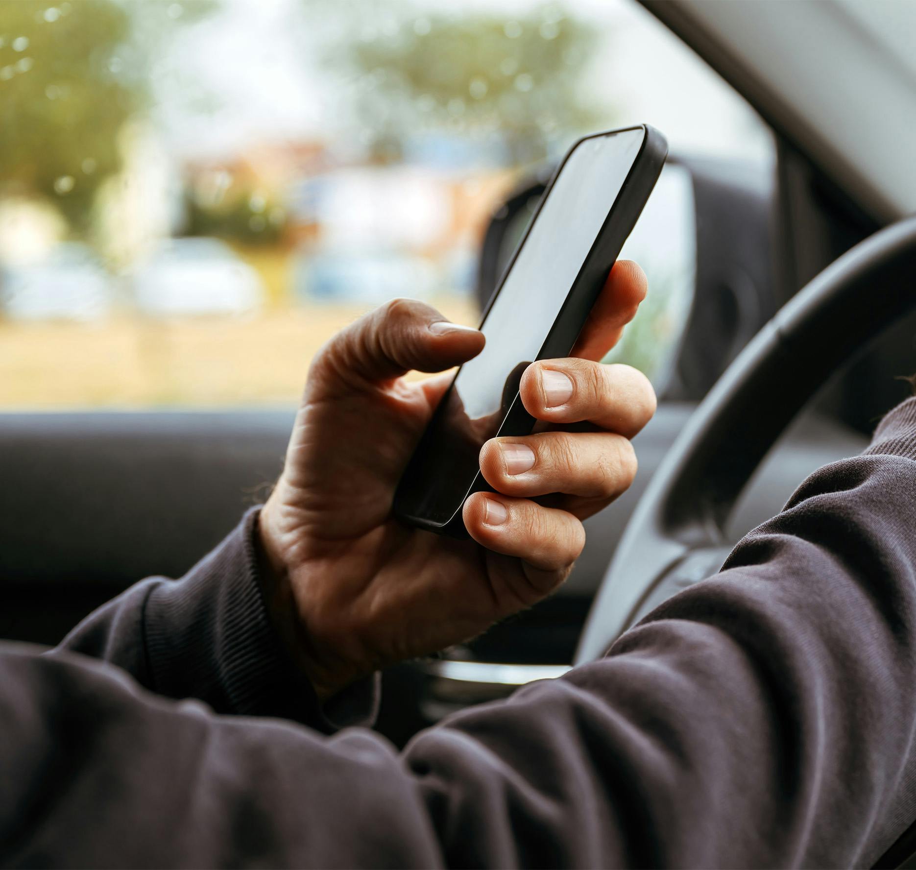 person on phone while driving