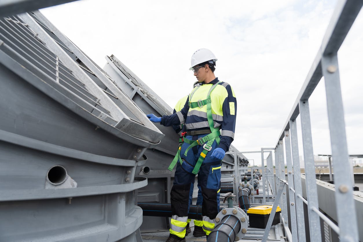 worker on top of a building