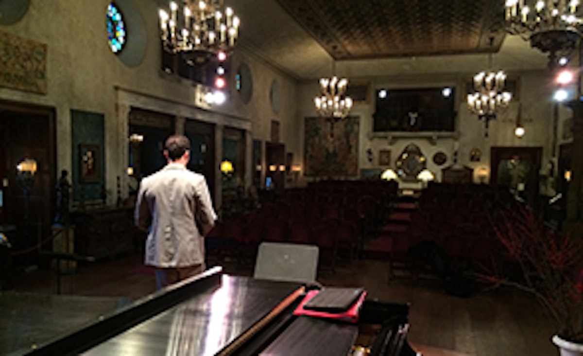 Mason warms up in the vacant Music Room; photo by Chen.