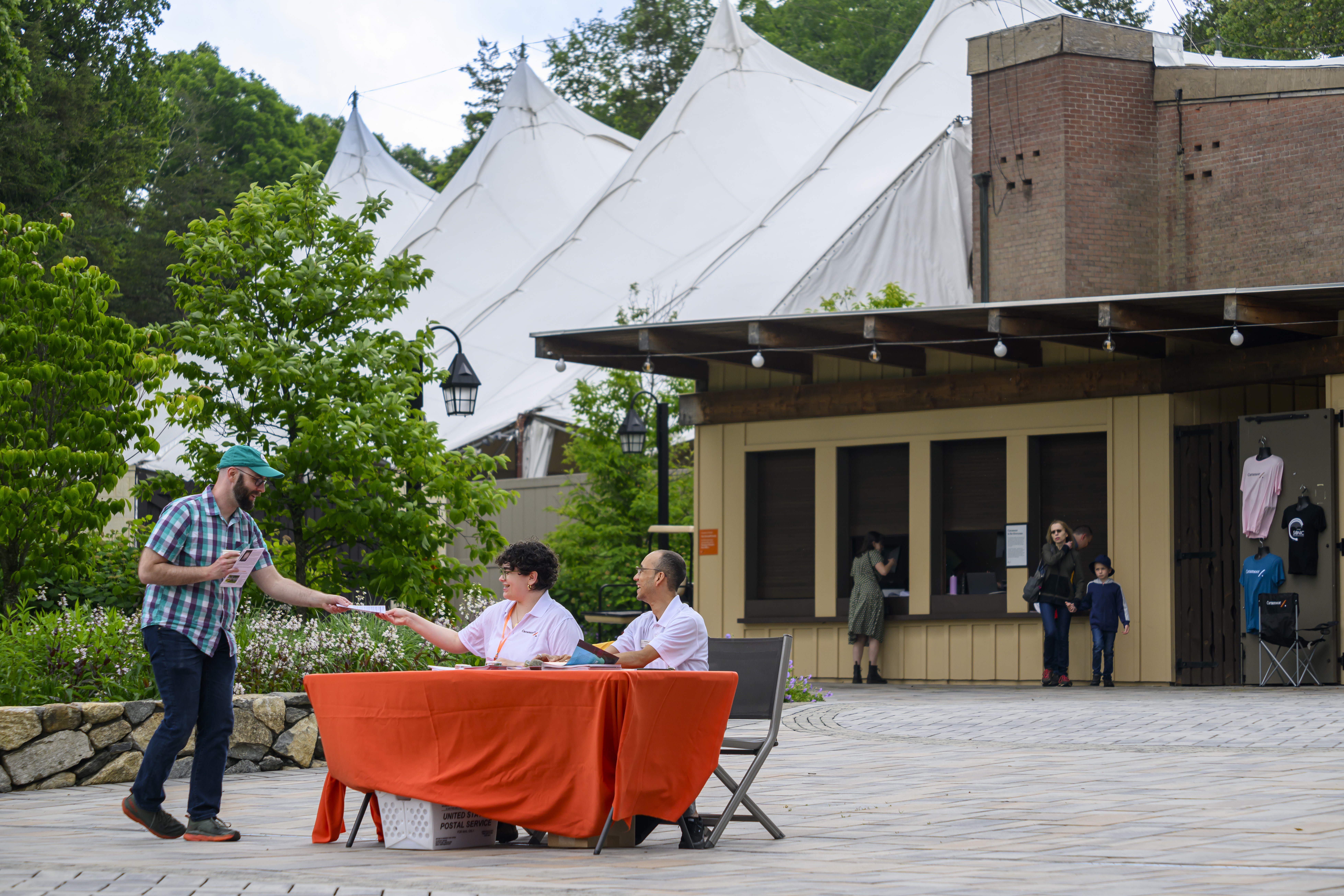 A guest arrives at Caramoor
