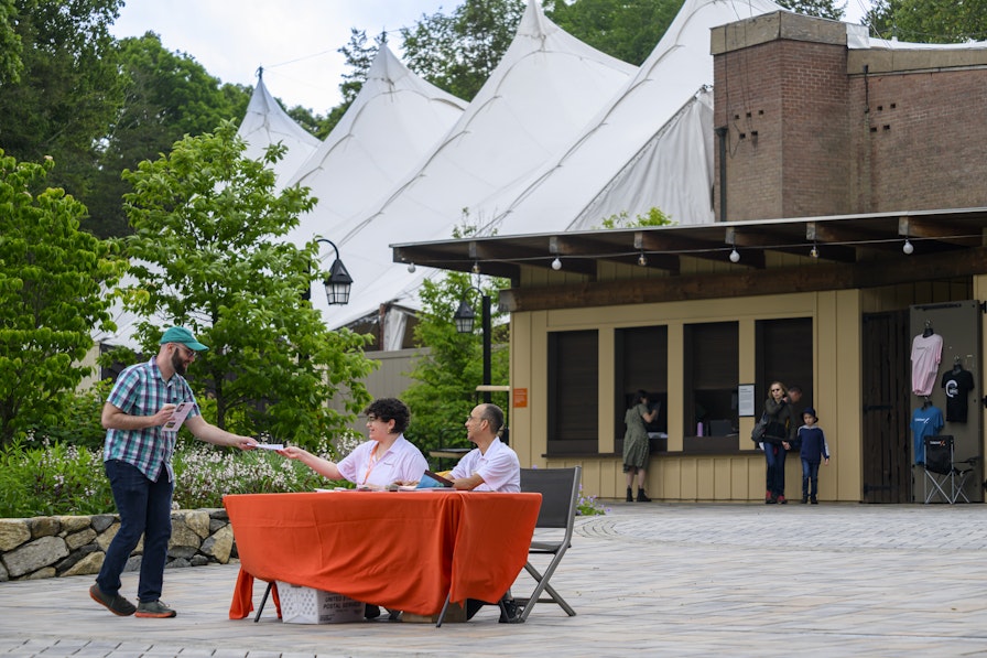 A guest arrives at Caramoor