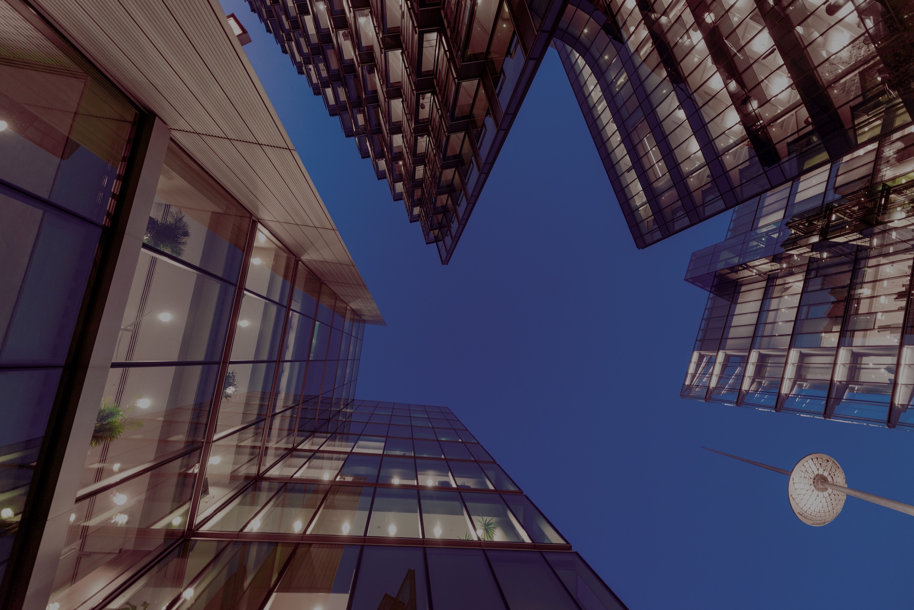 Looking up at glass buildings