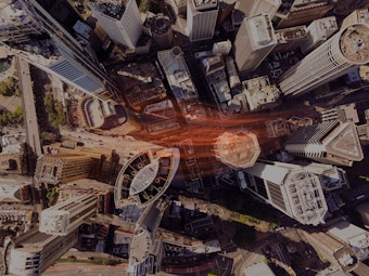 An overhead view of buildings in a large, densely populated city