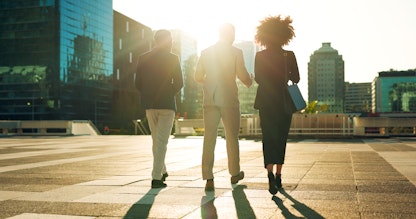 Business people walking away