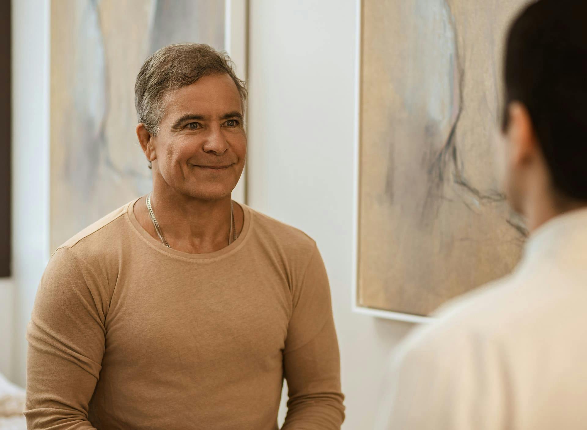 male patient smiling at doctor