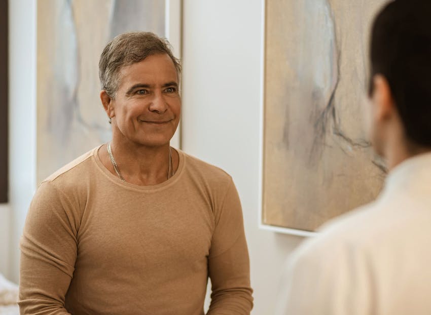 male patient smiling at doctor