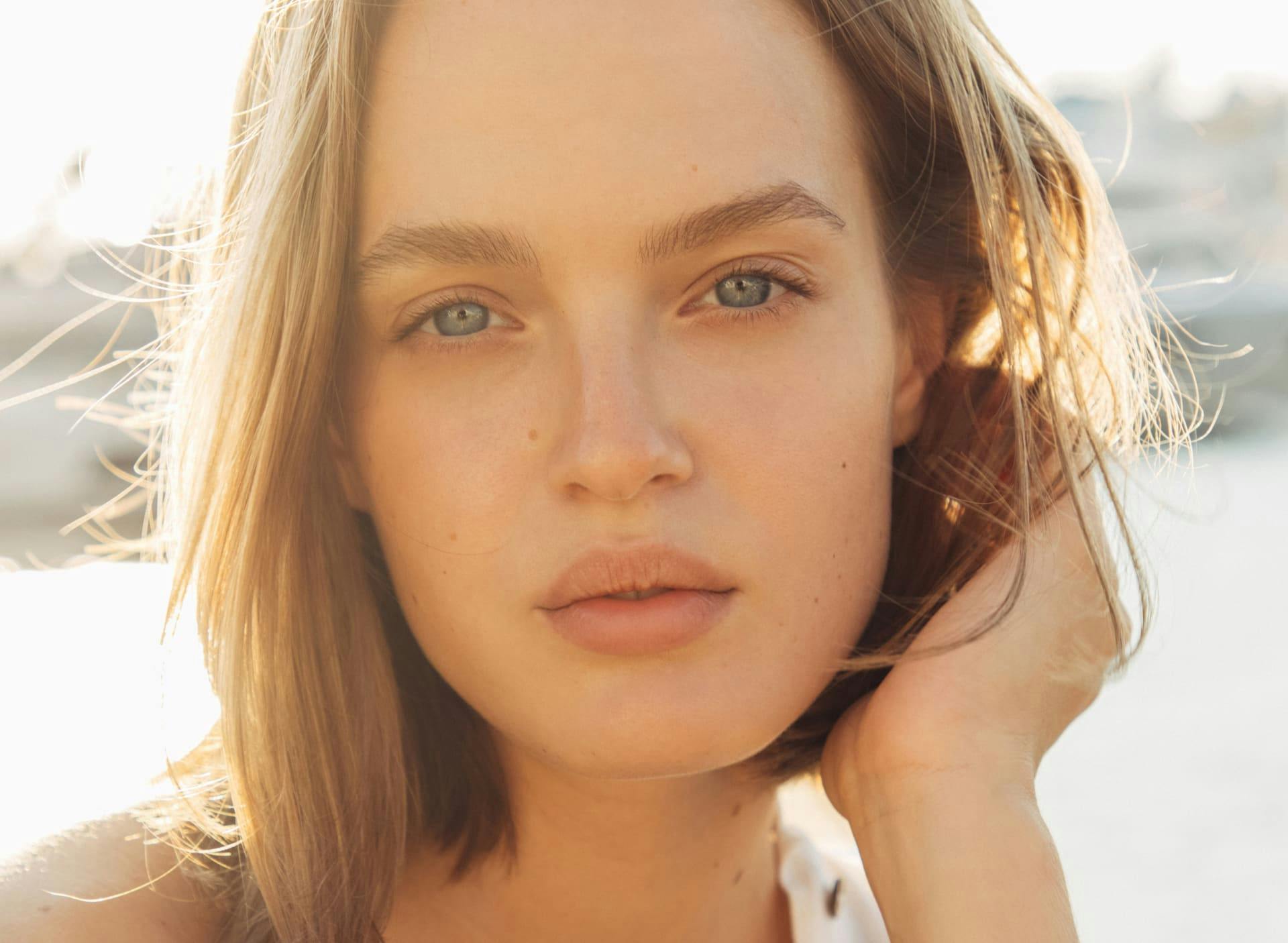 woman touching her hair