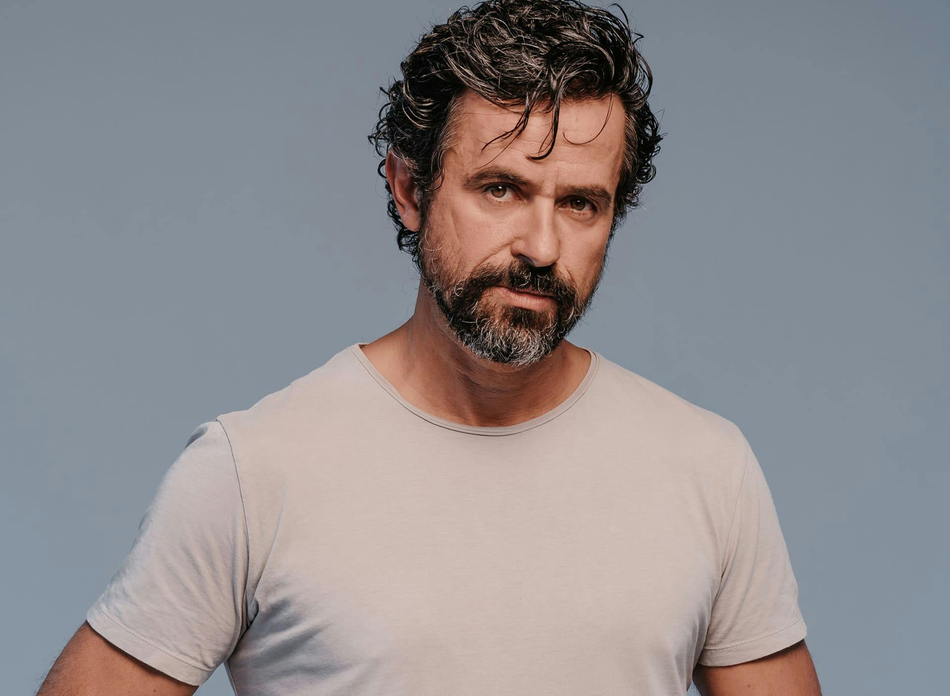 Man in white shirt looking forward