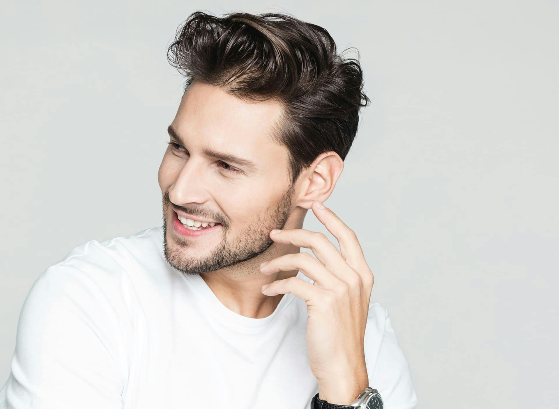 man smiling and looking to the left