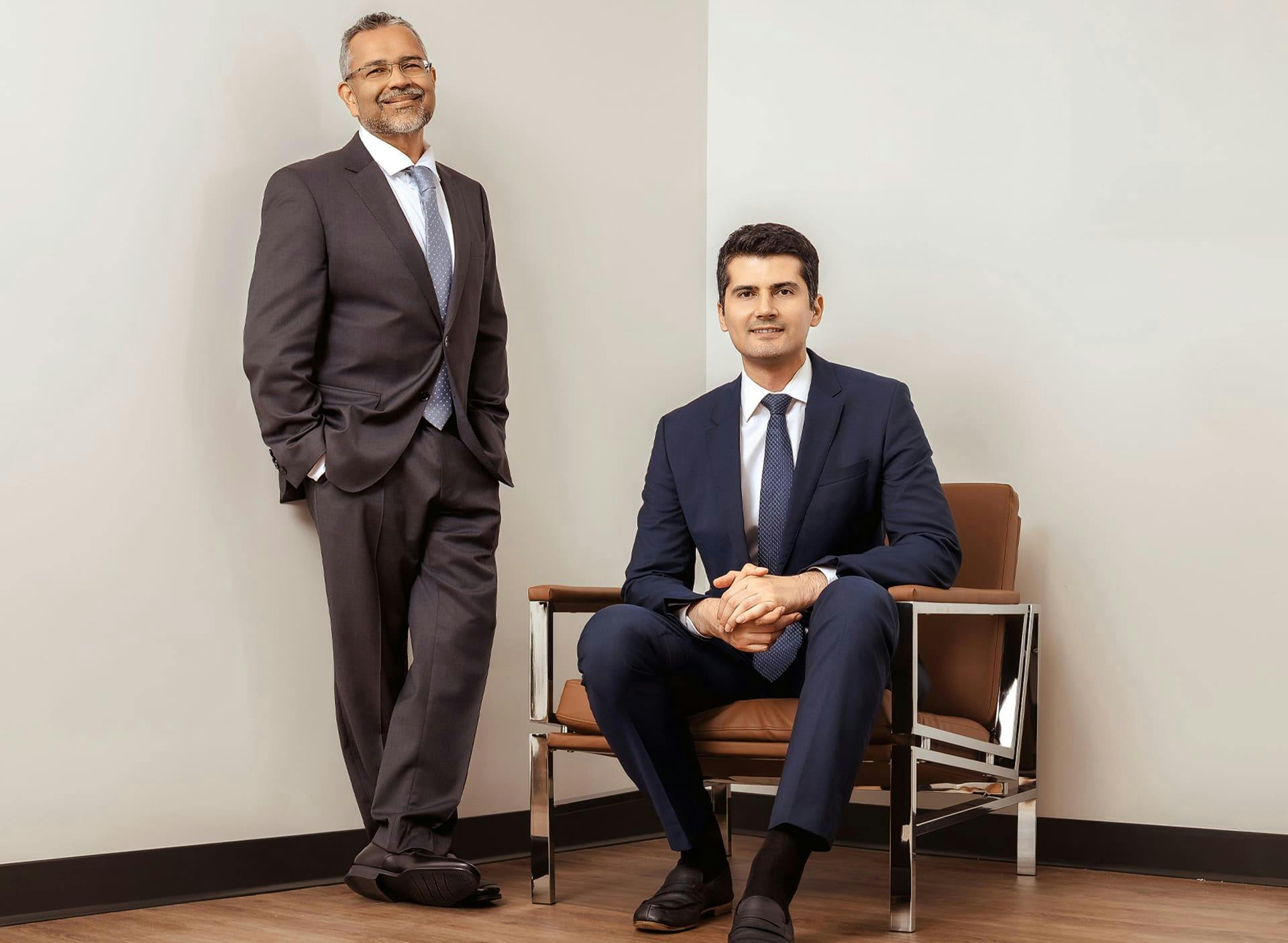 Dr. Cagri Cakmakogul and Dr. Munish Batra in suits