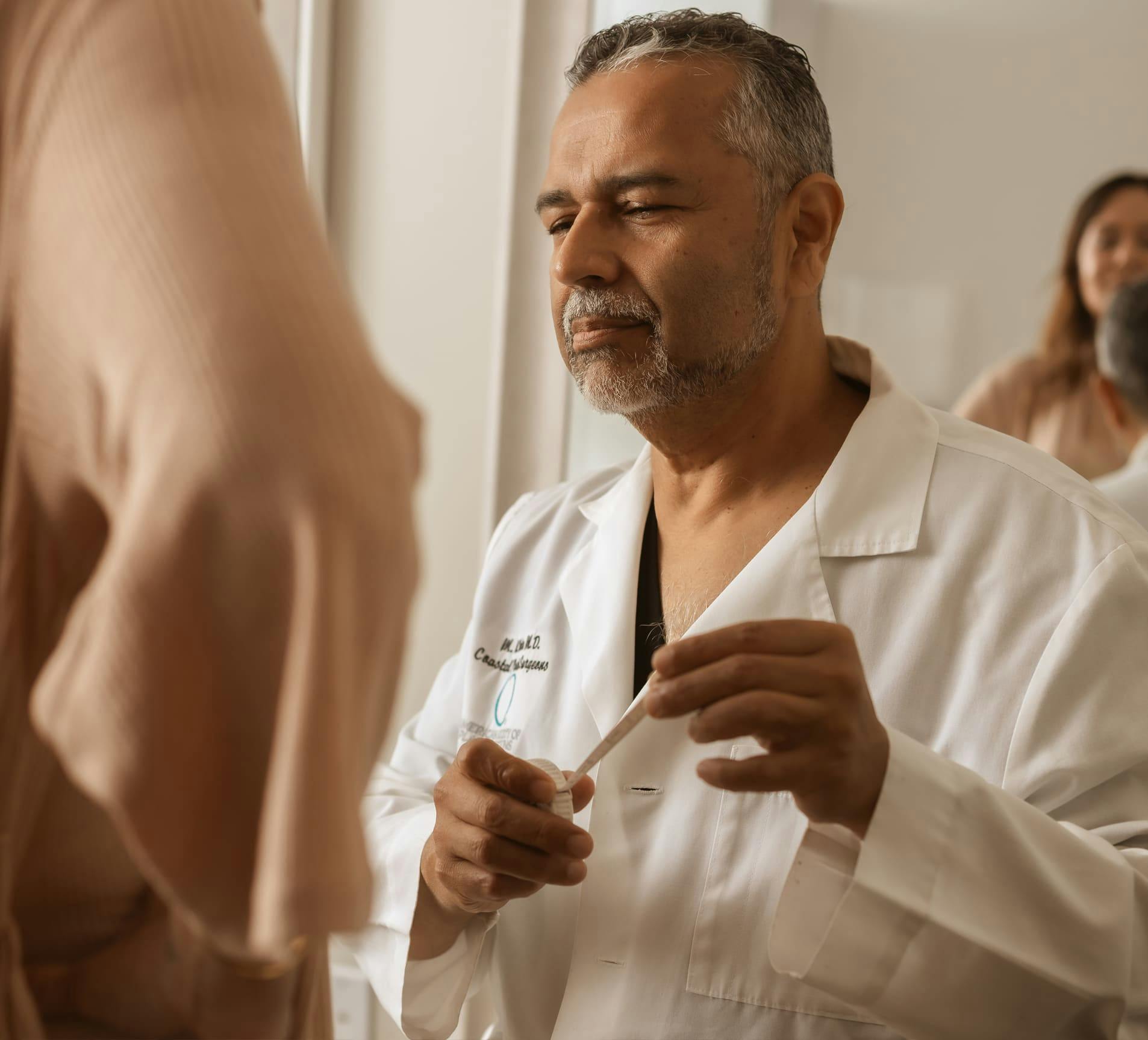 Dr. Munish Batra with female patient