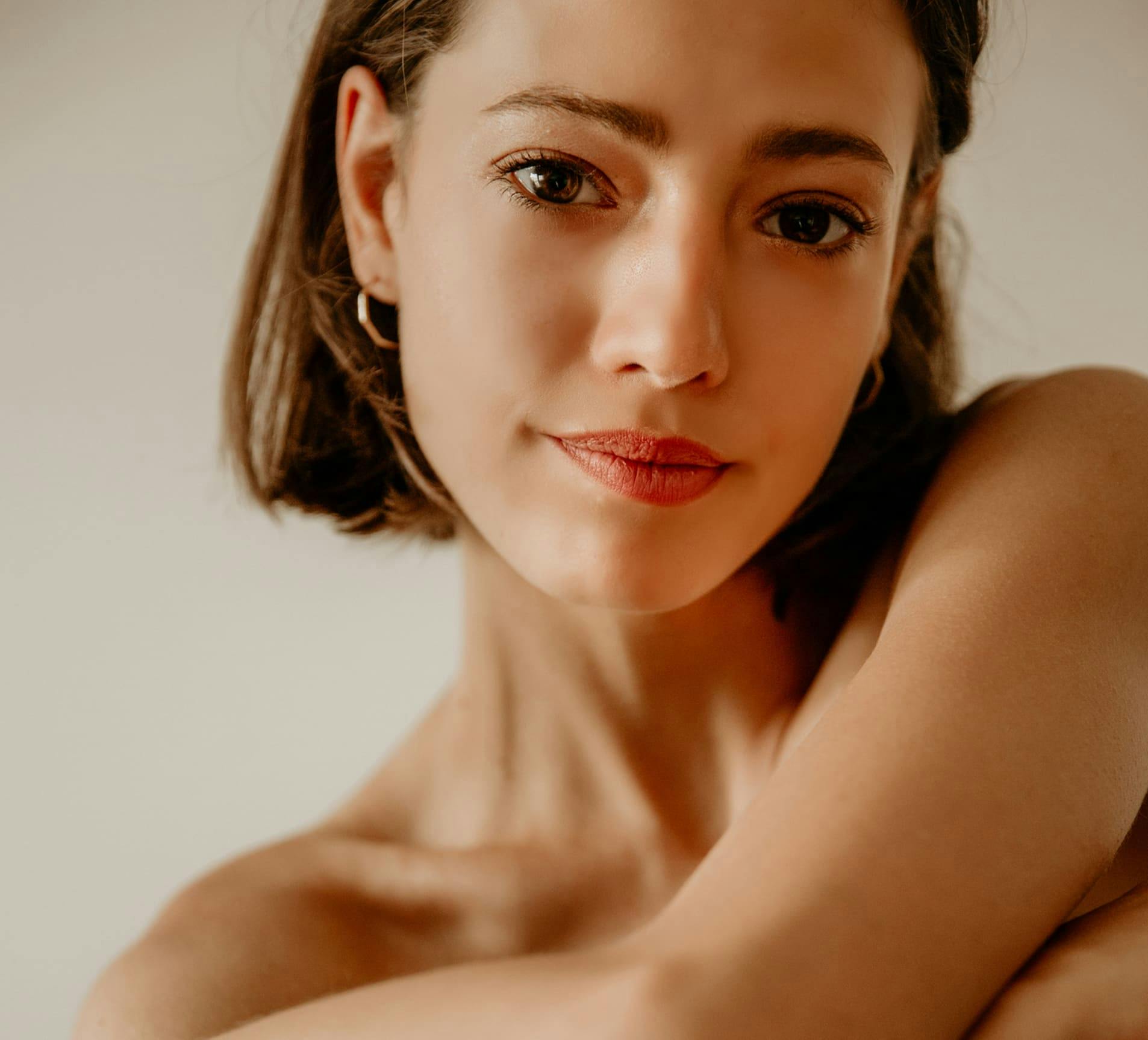 woman with short hair looking forward