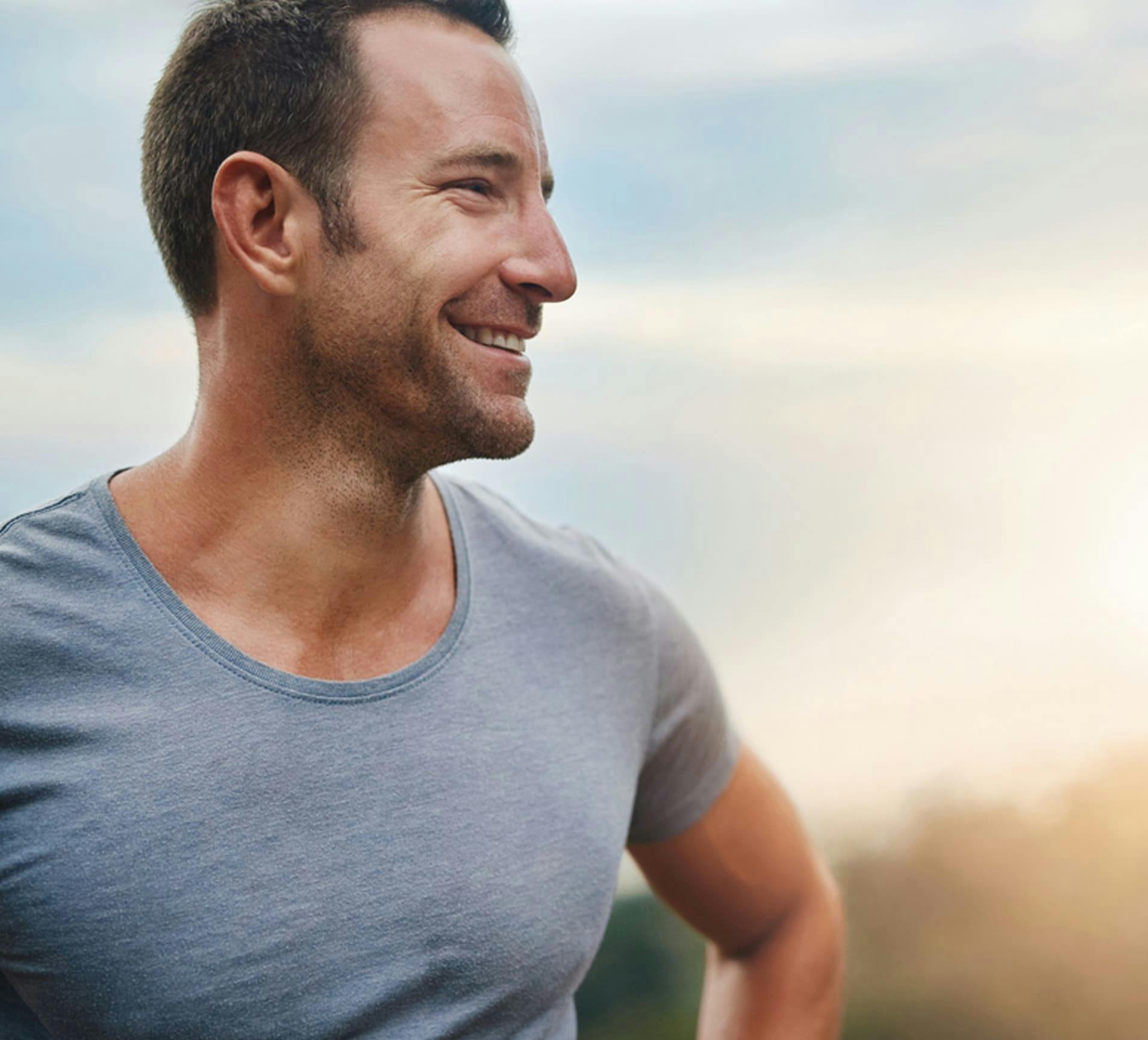 man smiling while outside