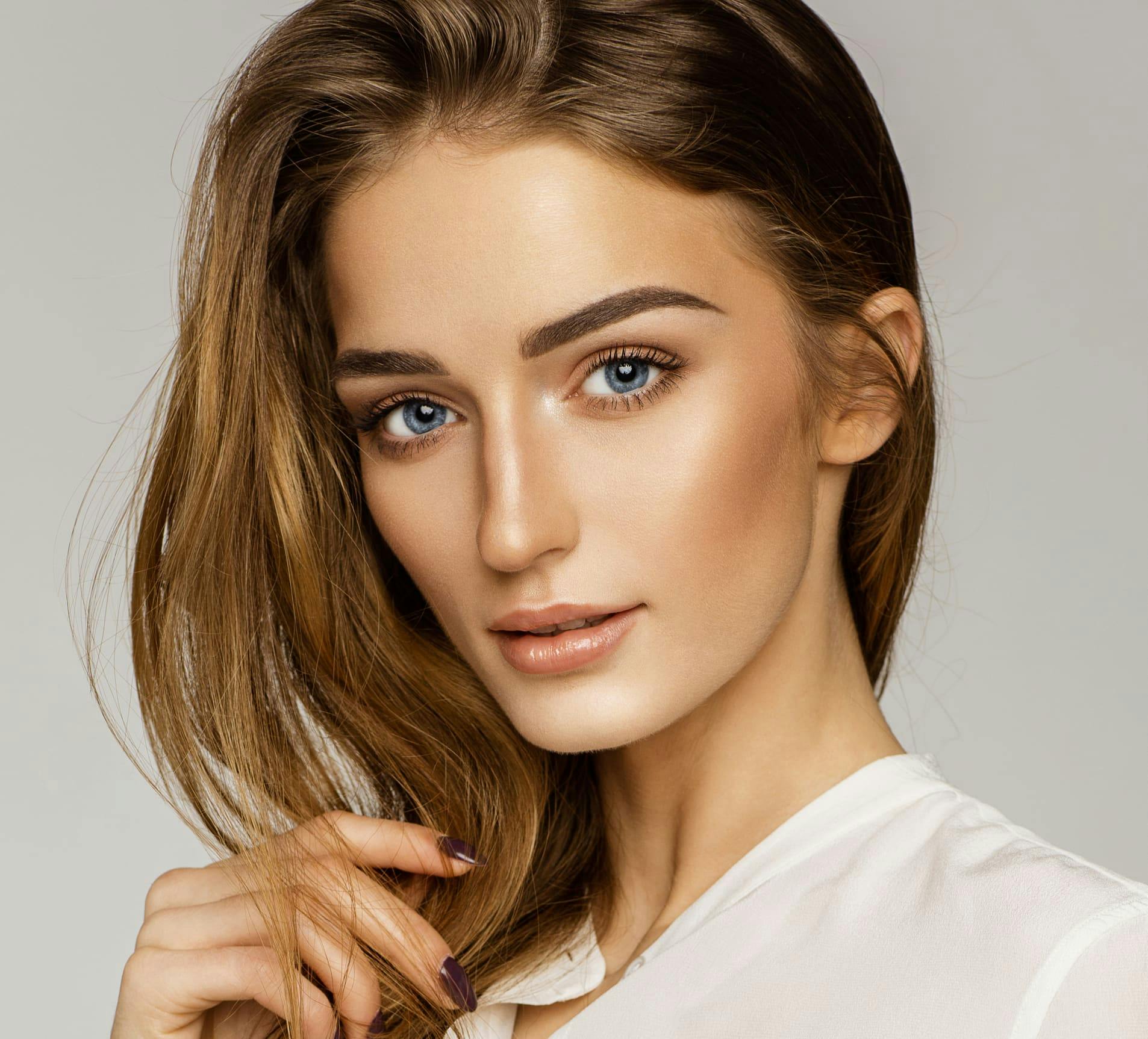 woman looking forward with her hair on one side