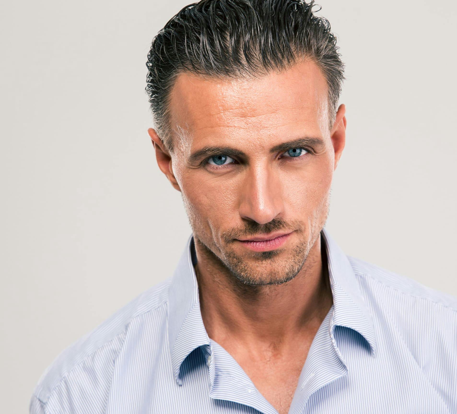 man looking forward with his hair slicked back