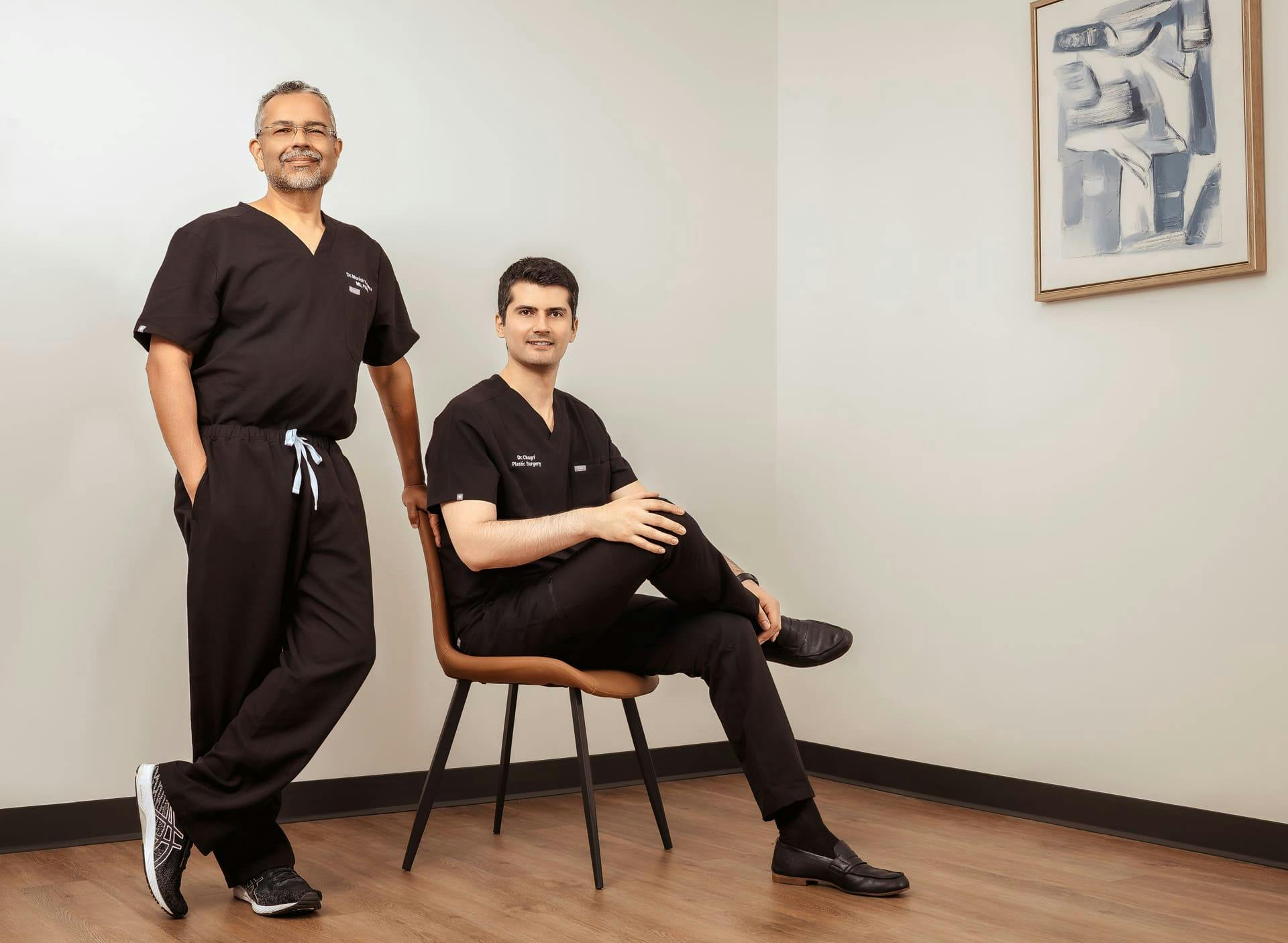 both doctors with one sitting down