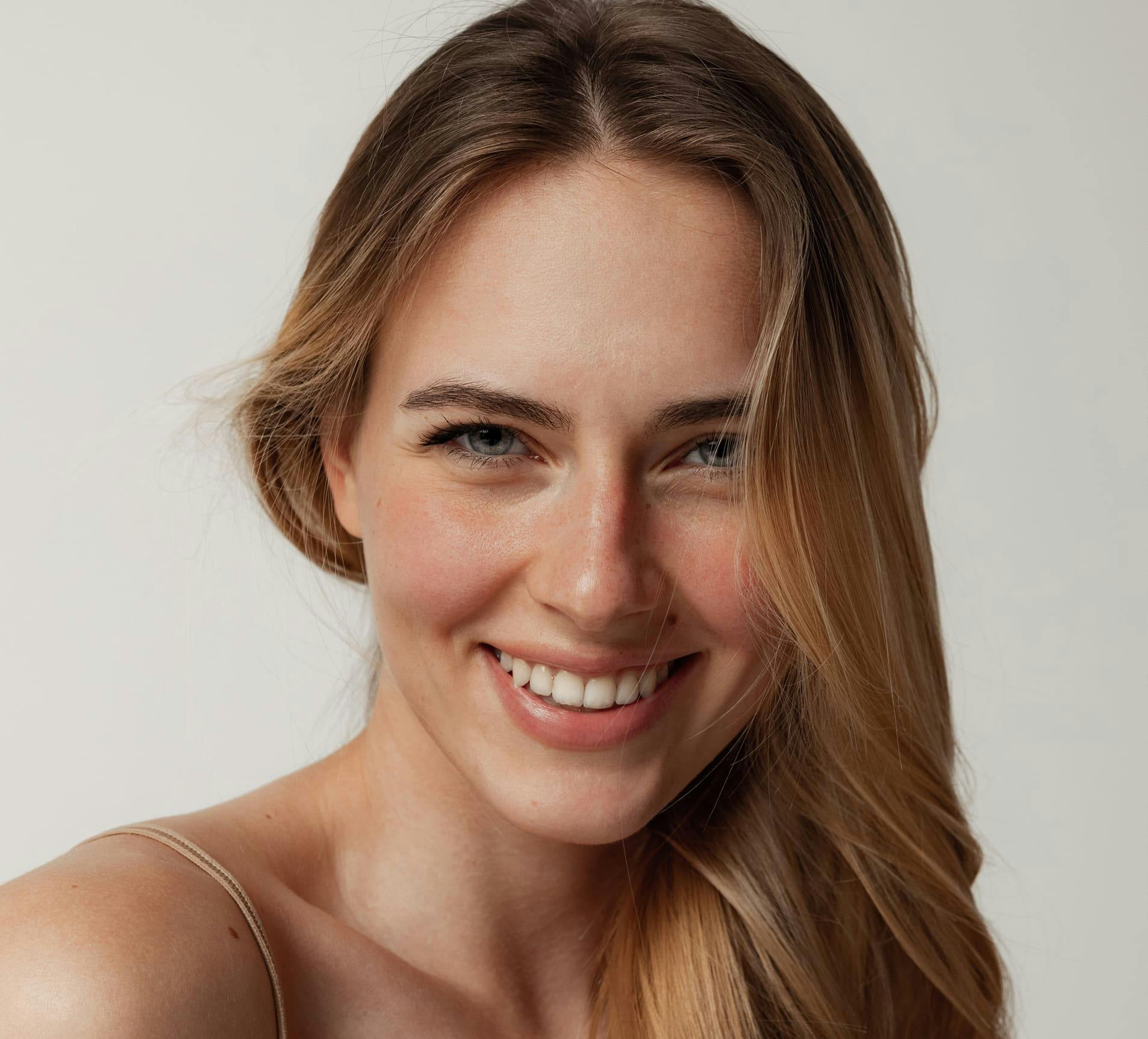 woman smiling and looking forward