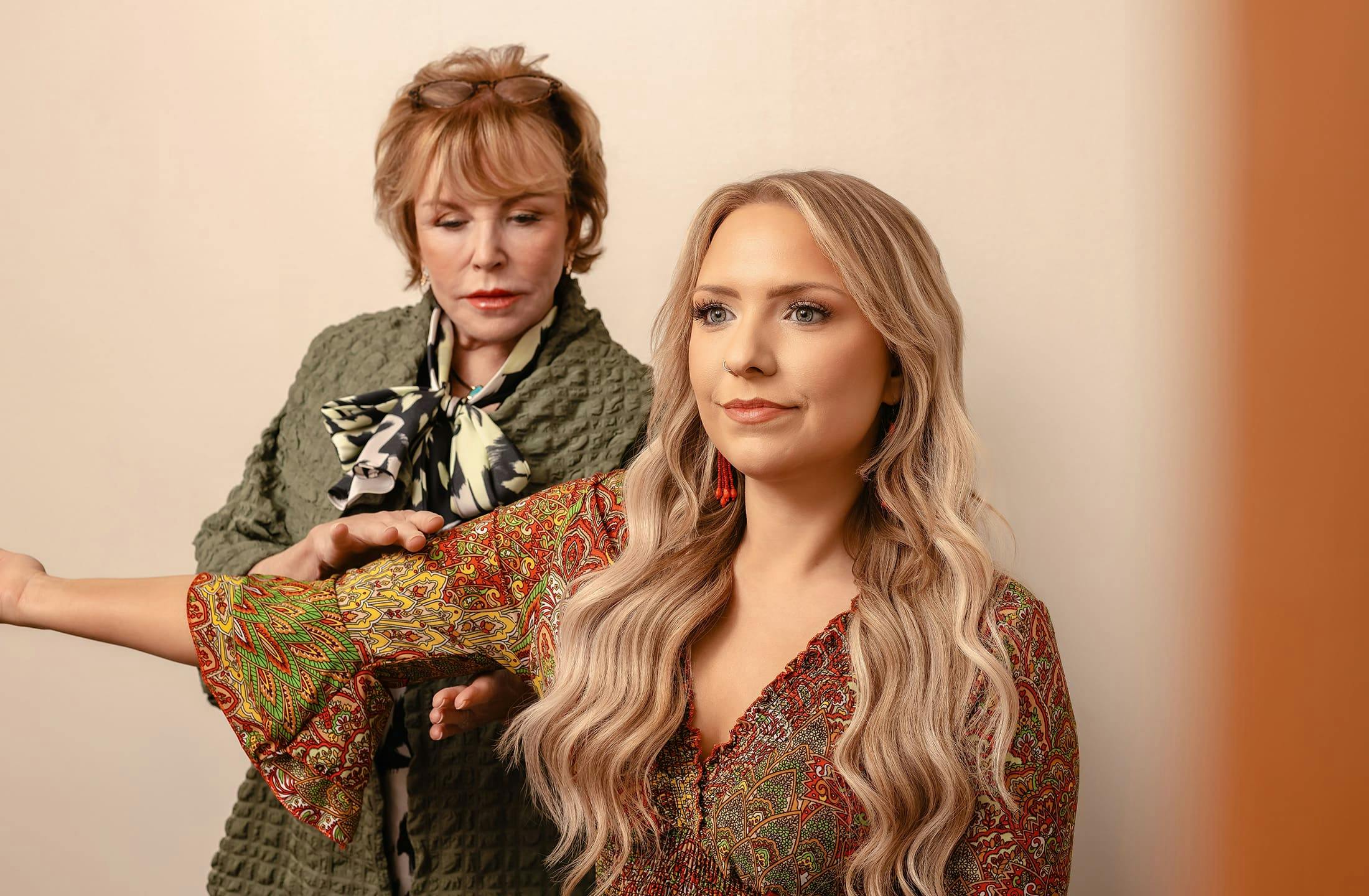 Dr. Duncan with patient with her arm raised to the side