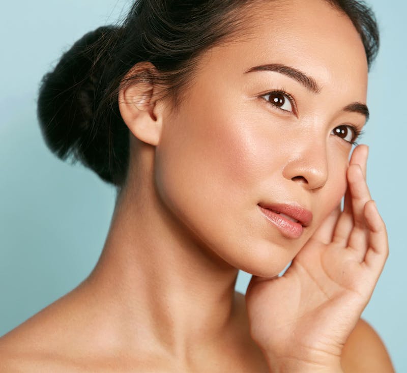 Woman touching her face