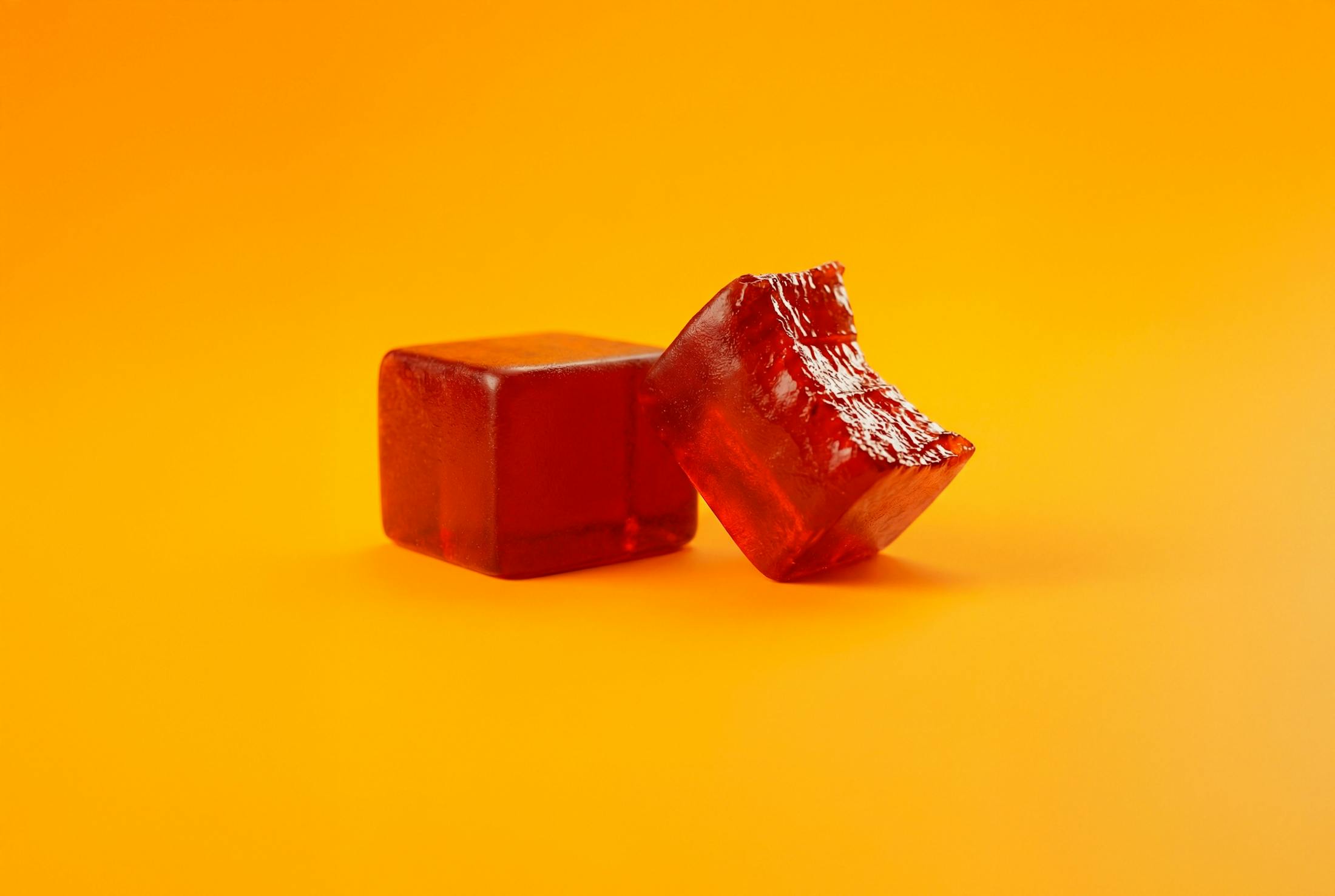 two red gummies one is half bitten