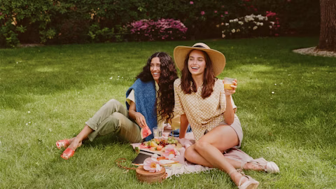 grass, hat, person, backyard, outdoors, lawn, cup, shoe, portrait, park